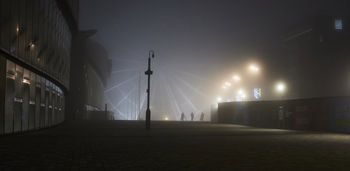 Liverpool wheel fog This urban photograph captures the Liverpool wheel, also known as the Liverpool Waterfront Ferris wheel, enveloped in thick fog on an autumn evening in Liverpool, United Kingdom. Illuminated streetlights and building lights are visible through the mist, adding a subdued glow to the scene, while silhouettes of people walk across the paved plaza in front of the wheel. The fog creates a soft veil over the landmarks and modern architecture, contributing to the atmospheric qualities typical of autumn nights in this urban part of Liverpool.